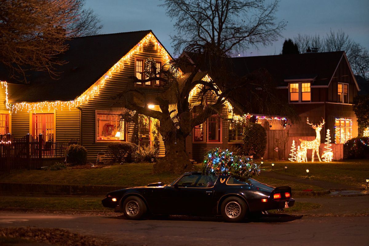 Neighborhood homes decorated with exterior christmas lights and holiday lighting displays